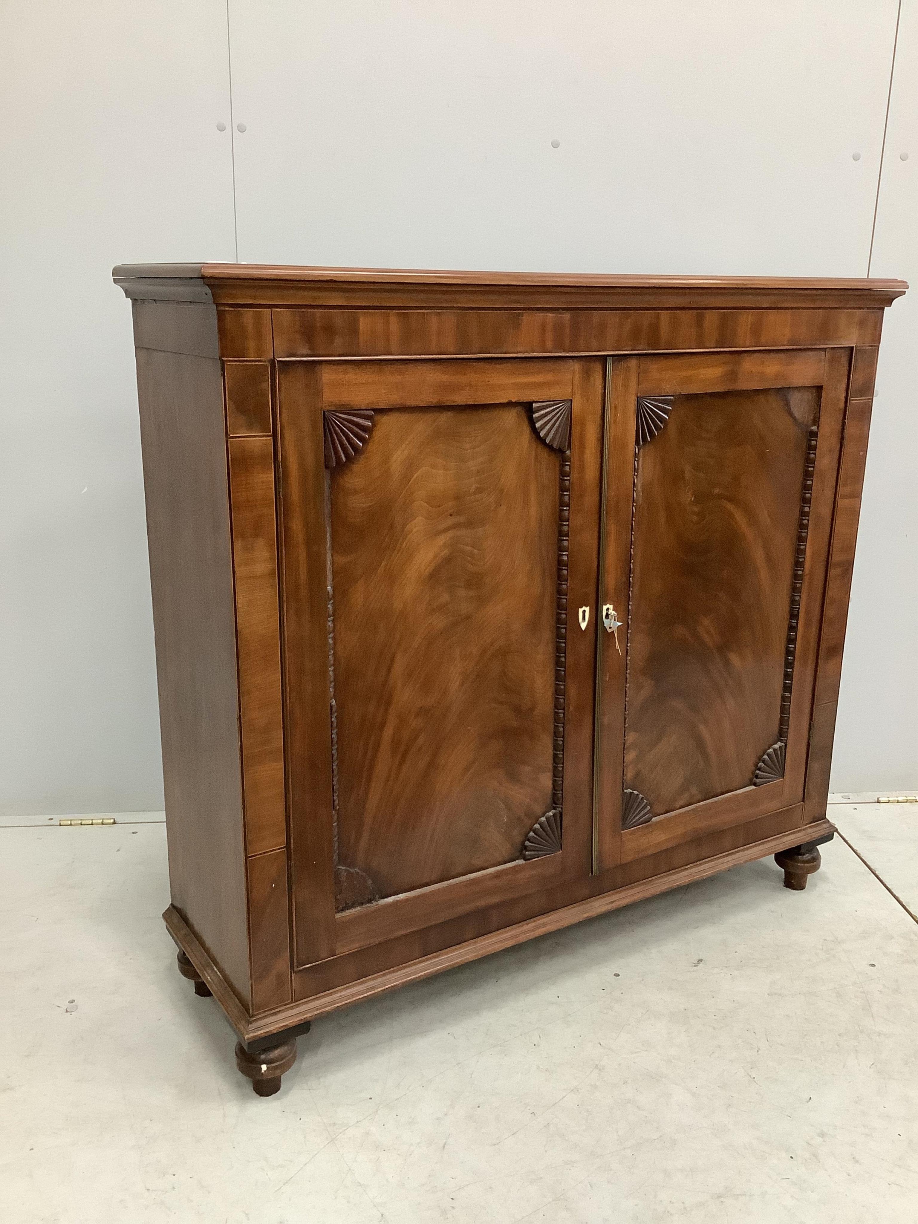 An early Victorian mahogany side cabinet, with bone escutcheons, width 118cm, depth 36cm, height 111cm. Condition - poor to fair